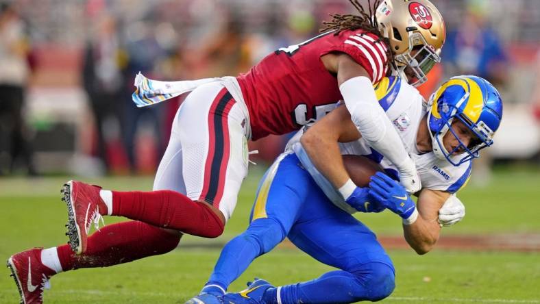 Oct 3, 2022; Santa Clara, California, USA; San Francisco 49ers linebacker Fred Warner (54) tackles Los Angeles Rams wide receiver Cooper Kupp (10) during the second quarter at Levi's Stadium. Mandatory Credit: Kyle Terada-USA TODAY Sports