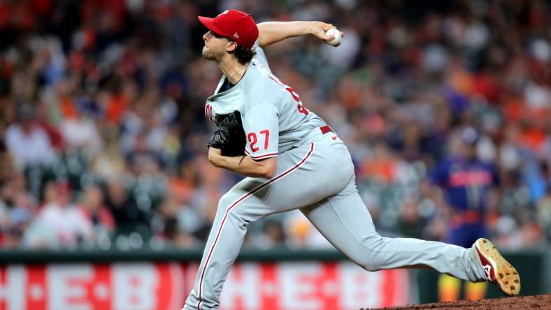 Oct 3, 2022; Houston, Texas, USA; Philadelphia Phillies starting pitcher Aaron Nola (27) delivers a pitch against the Houston Astros during the seventh inning at Minute Maid Park. Mandatory Credit: Erik Williams-USA TODAY Sports