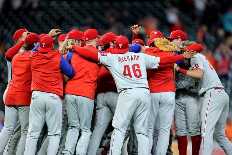 Oct 3, 2022; Houston, Texas, USA; Members of the Philadelphia Phillies celebrate after the final out against the Houston Astros during the ninth inning at Minute Maid Park. Philadelphia won 3-0 to clinch a National League Wild Card berth. Mandatory Credit: Erik Williams-USA TODAY Sports