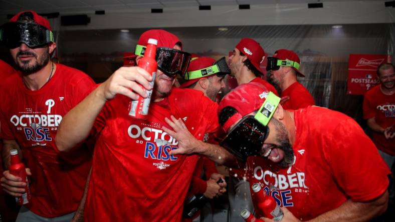 Oct 3, 2022; Houston, Texas, USA; Members of the Philadelphia Phillies celebrate in the locker room following a 3-0 victory over the Houston Astros at Minute Maid Park. Philadelphia clinched a National League Wild Card berth with the win. Mandatory Credit: Erik Williams-USA TODAY Sports