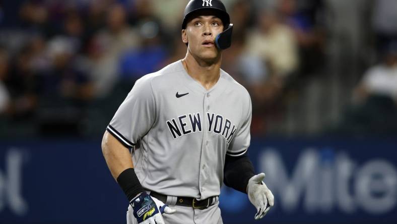 Oct 4, 2022; Arlington, Texas, USA;  New York Yankees designated hitter Aaron Judge (99) watches a replay of his pop out in the fifth inning against the Texas Rangers at Globe Life Field. Mandatory Credit: Tim Heitman-USA TODAY Sports