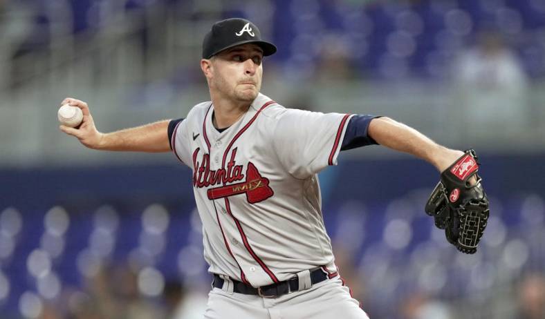 Oct 4, 2022; Miami, Florida, USA; Atlanta Braves starting pitcher Jake Odorizzi (12) delivers in the first inning against the Miami Marlins at loanDepot Park. Mandatory Credit: Jim Rassol-USA TODAY Sports