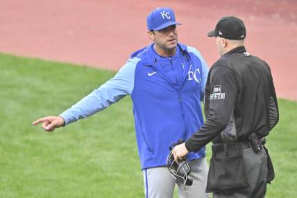 Oct 4, 2022; Cleveland, Ohio, USA; Kansas City Royals manager Mike Matheny (22) talks with home plate umpire Nic Lentz (59) in the first inning against the Cleveland Guardians at Progressive Field. Mandatory Credit: David Richard-USA TODAY Sports