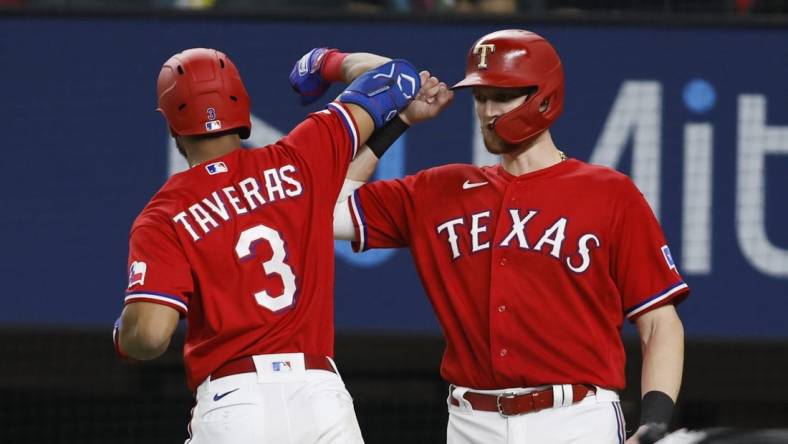 Oct 4, 2022; Arlington, Texas, USA; Texas Rangers center fielder Leody Taveras (3) is congratulated by catcher Sam Huff (55) after hitting a two-run home run against the New York Yankees in the fifth inning at Globe Life Field. Mandatory Credit: Tim Heitman-USA TODAY Sports