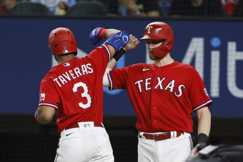 Oct 4, 2022; Arlington, Texas, USA; Texas Rangers center fielder Leody Taveras (3) is congratulated by catcher Sam Huff (55) after hitting a two-run home run against the New York Yankees in the fifth inning at Globe Life Field. Mandatory Credit: Tim Heitman-USA TODAY Sports