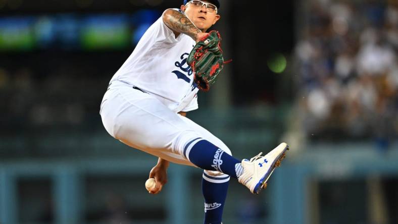 Oct 4, 2022; Los Angeles, California, USA;  Los Angeles Dodgers starting pitcher Julio Urias (7) throws to the plate in the first inning against the Colorado Rockies at Dodger Stadium. Mandatory Credit: Jayne Kamin-Oncea-USA TODAY Sports