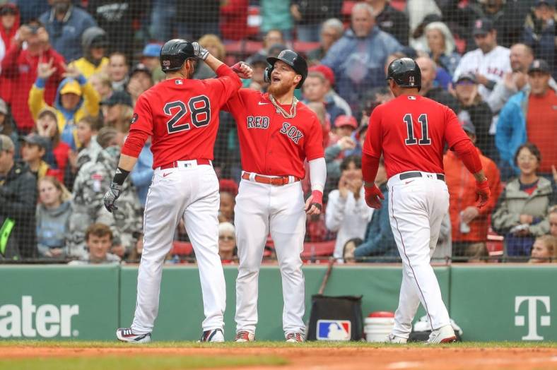 Oct 5, 2022; Boston, Massachusetts, USA; Boston Red Sox designated hitter JD Martinez (28) celebrates with Boston Red Sox right fielder Alex Verdugo (99) after hitting a three run home run during the first inning against the Tampa Bay Rays at Fenway Park. Mandatory Credit: Paul Rutherford-USA TODAY Sports