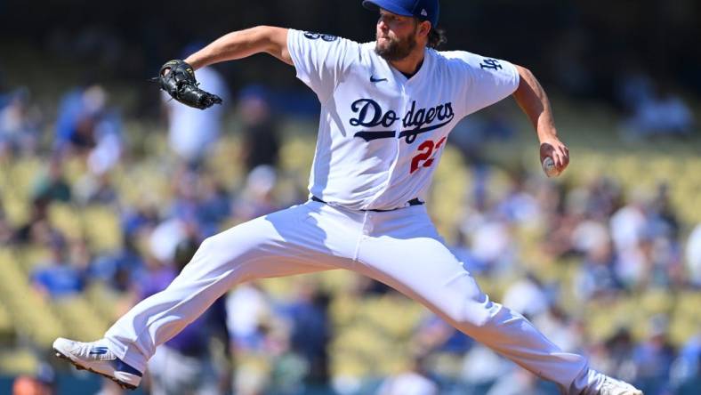 Oct 5, 2022; Los Angeles, California, USA;  Los Angeles Dodgers starting pitcher Clayton Kershaw (22) throws to the plate in the first inning against the Colorado Rockies at Dodger Stadium. Mandatory Credit: Jayne Kamin-Oncea-USA TODAY Sports