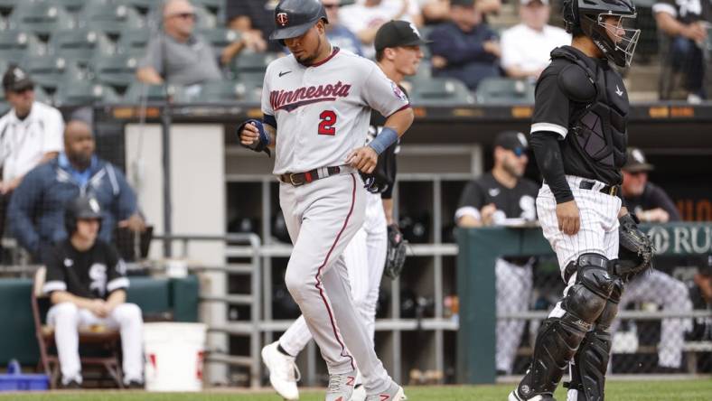 Oct 5, 2022; Chicago, Illinois, USA; Minnesota Twins first baseman Luis Arraez (2) scores against the Chicago White Sox during the second inning at Guaranteed Rate Field. Mandatory Credit: Kamil Krzaczynski-USA TODAY Sports