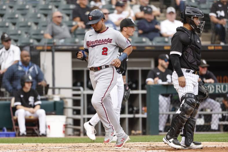 Oct 5, 2022; Chicago, Illinois, USA; Minnesota Twins first baseman Luis Arraez (2) scores against the Chicago White Sox during the second inning at Guaranteed Rate Field. Mandatory Credit: Kamil Krzaczynski-USA TODAY Sports