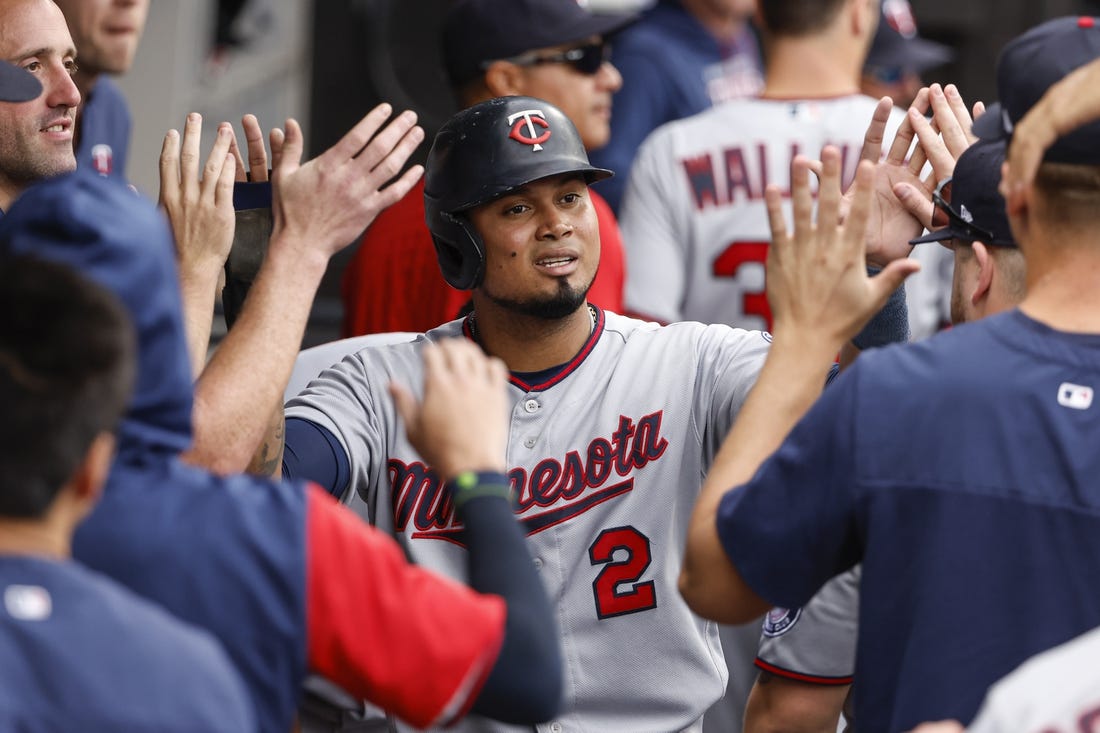 Oct 5, 2022; Chicago, Illinois, USA; Minnesota Twins first baseman Luis Arraez (2) celebrates with teammates after scoring against the Chicago White Sox during the second inning at Guaranteed Rate Field. Mandatory Credit: Kamil Krzaczynski-USA TODAY Sports