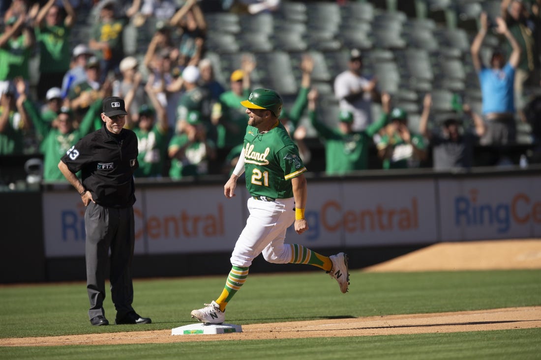Oct 5, 2022; Oakland, California, USA; Oakland Athletics catcher Stephen Vogt (21) runs out his solo home run against the Los Angeles Angels during the seventh inning at RingCentral Coliseum. Umpire is Lance Barksdale. Mandatory Credit: D. Ross Cameron-USA TODAY Sports