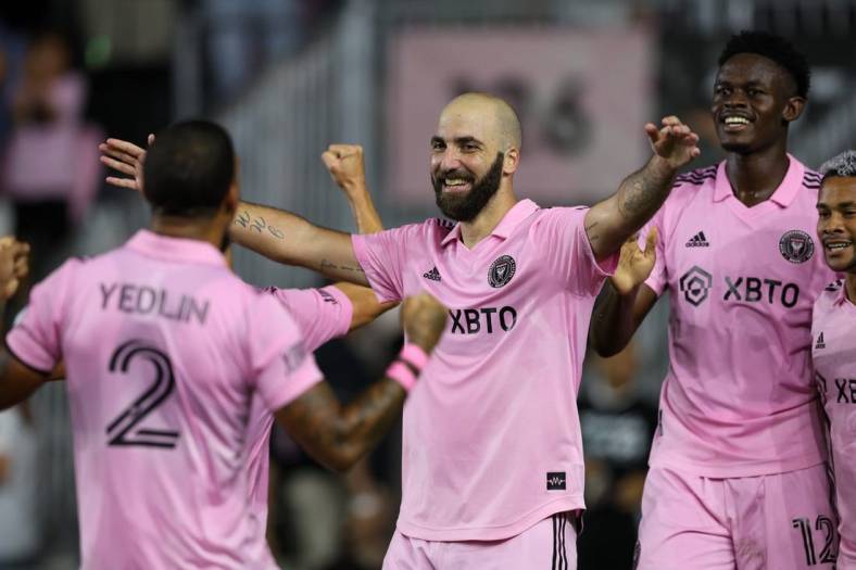 Oct 5, 2022; Fort Lauderdale, Florida, USA;  Inter Miami forward Gonzalo Higuain (10) is congratulated by defender DeAndre Yedlin (2) after scoring a goal against Orlando City in the first half  at DRV PNK Stadium. Mandatory Credit: Nathan Ray Seebeck-USA TODAY Sports