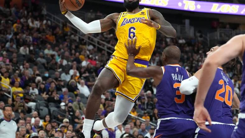 Oct 5, 2022; Las Vegas, Nevada, USA; Los Angeles Lakers forward LeBron James (6) shoots against Phoenix Suns guard Chris Paul (3) during a preseason game at T-Mobile Arena. Mandatory Credit: Stephen R. Sylvanie-USA TODAY Sports