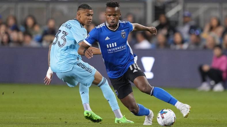 Oct 1, 2022; San Jose, California, USA; San Jose Earthquakes forward Jeremy Ebobisse (11) dribbles against Minnesota United midfielder Kervin Arriaga (33) during the first half at PayPal Park. Mandatory Credit: Darren Yamashita-USA TODAY Sports