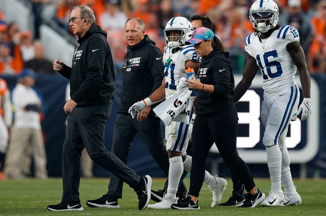 Oct 6, 2022; Denver, Colorado, USA; Indianapolis Colts running back Nyheim Hines (21) is helped off the field in the first quarter against the Denver Broncos at Empower Field at Mile High. Mandatory Credit: Isaiah J. Downing-USA TODAY Sports