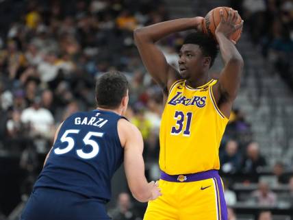 Oct 6, 2022; Las Vegas, Nevada, USA; Los Angeles Lakers center Thomas Bryant (31) looks to pass the ball as Minnesota Timberwolves center Luka Garza (55) defends during a preseason game at T-Mobile Arena. Mandatory Credit: Stephen R. Sylvanie-USA TODAY Sports