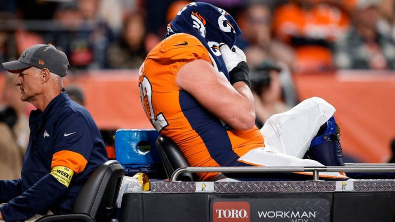 Oct 6, 2022; Denver, Colorado, USA; Denver Broncos offensive tackle Garett Bolles (72) is carted off the field in the fourth quarter against the Indianapolis Colts at Empower Field at Mile High. Mandatory Credit: Isaiah J. Downing-USA TODAY Sports