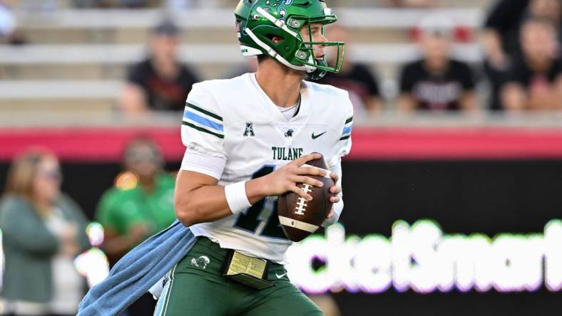 Sep 30, 2022; Houston, Texas, USA;  Tulane Green Wave quarterback Kai Horton (12) looks to pass the ball during the first quarter against the Tulane Green Wave at TDECU Stadium in Houston, Texas. Mandatory Credit: Maria Lysaker-USA TODAY Sports