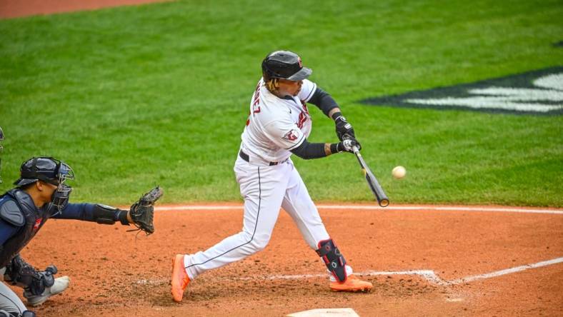 Oct 7, 2022; Cleveland, Ohio, USA; Cleveland Guardians third baseman Jose Ramirez (11) hits a two run home run against the Tampa Bay Rays in the sixth inning during game one of the Wild Card series for the 2022 MLB Playoffs at Progressive Field. Mandatory Credit: David Richard-USA TODAY Sports