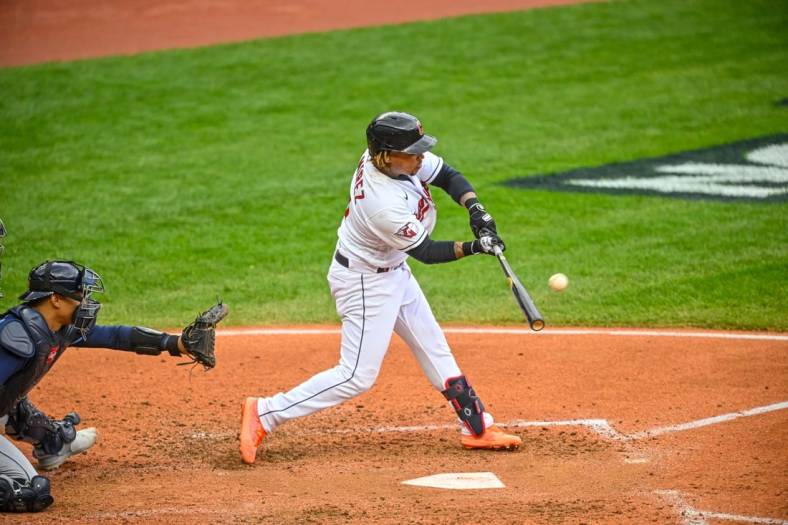Oct 7, 2022; Cleveland, Ohio, USA; Cleveland Guardians third baseman Jose Ramirez (11) hits a two run home run against the Tampa Bay Rays in the sixth inning during game one of the Wild Card series for the 2022 MLB Playoffs at Progressive Field. Mandatory Credit: David Richard-USA TODAY Sports