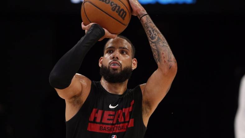 Oct 7, 2022; Memphis, Tennessee, USA; Miami Heat forward Caleb Martin (16) shoots prior to the game against the Memphis Grizzlies at FedExForum. Mandatory Credit: Petre Thomas-USA TODAY Sports