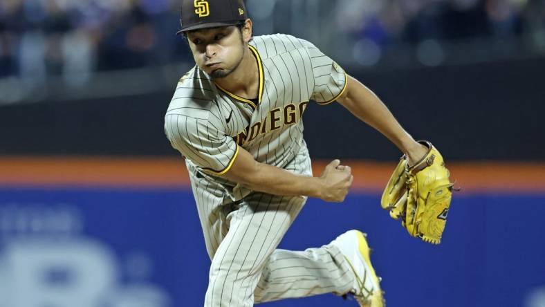 Oct 7, 2022; New York City, New York, USA; San Diego Padres starting pitcher Yu Darvish (11) throws a pitch in the first inning during game one of the Wild Card series against the New York Mets for the 2022 MLB Playoffs at Citi Field. Mandatory Credit: Brad Penner-USA TODAY Sports