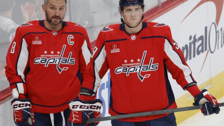 Oct 5, 2022; Washington, District of Columbia, USA; Washington Capitals left wing Alex Ovechkin (8) stands with Capitals center Aliaksei Protas (59) on ice prior to the Capitals' game against the Detroit Red Wings at Capital One Arena. Mandatory Credit: Geoff Burke-USA TODAY Sports