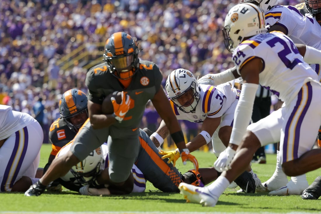 Oct 8, 2022; Baton Rouge, Louisiana, USA;  Tennessee Volunteers running back Jabari Small (2) is tackled by LSU Tigers cornerback Jarrick Bernard-Converse (24) during the first half at Tiger Stadium. Mandatory Credit: Stephen Lew-USA TODAY Sports