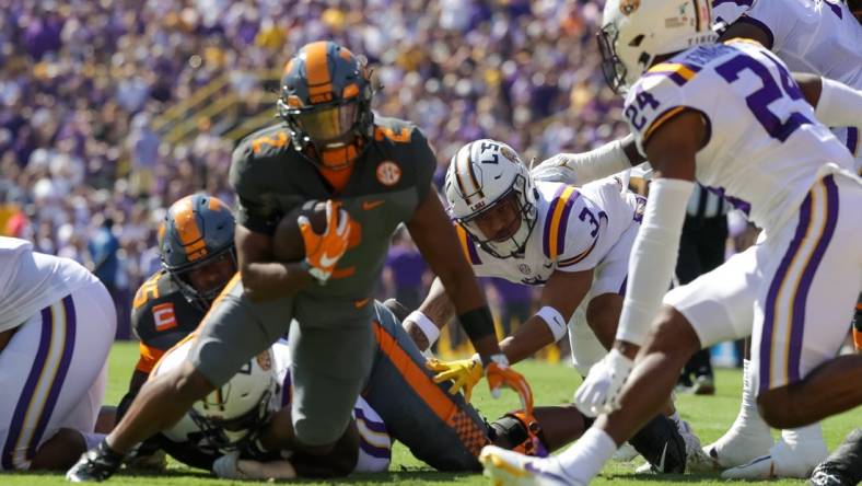 Oct 8, 2022; Baton Rouge, Louisiana, USA;  Tennessee Volunteers running back Jabari Small (2) is tackled by LSU Tigers cornerback Jarrick Bernard-Converse (24) during the first half at Tiger Stadium. Mandatory Credit: Stephen Lew-USA TODAY Sports