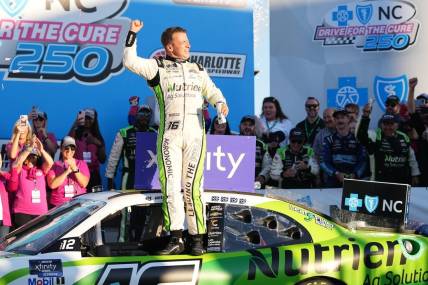 Oct 8, 2022; Concord, North Carolina, USA; NASCAR Xfinity Series driver AJ Allmendinger (16) celebrates after winning the Drive for the Cure 250 at Charlotte Motor Speedway Road Course. Mandatory Credit: Jasen Vinlove-USA TODAY Sports