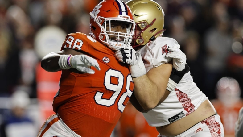 Oct 8, 2022; Chestnut Hill, Massachusetts, USA; Clemson Tigers defensive end Myles Murphy (98) fights to get past Boston College Eagles offensive lineman Ozzy Trapilo (70) during the second quarter at Alumni Stadium. Mandatory Credit: Winslow Townson-USA TODAY Sports