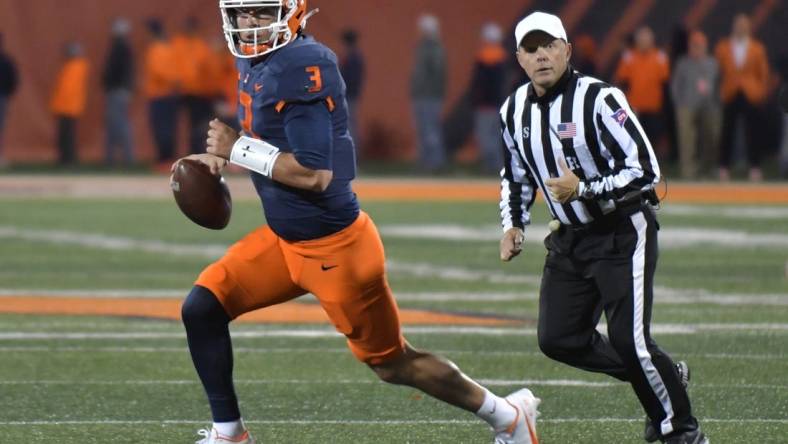 Oct 8, 2022; Champaign, Illinois, USA;  Illinois Fighting Illini quarterback Tommy DeVito (3) runs with the ball during the first half against the Iowa Hawkeyes at Memorial Stadium. Mandatory Credit: Ron Johnson-USA TODAY Sports