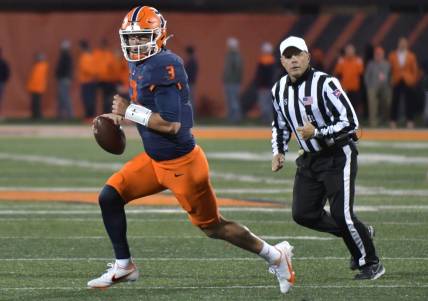 Oct 8, 2022; Champaign, Illinois, USA;  Illinois Fighting Illini quarterback Tommy DeVito (3) runs with the ball during the first half against the Iowa Hawkeyes at Memorial Stadium. Mandatory Credit: Ron Johnson-USA TODAY Sports
