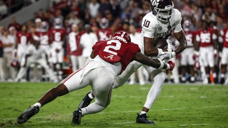 Oct 8, 2022; Tuscaloosa, Alabama, USA;  Texas A&M Aggies wide receiver Chris Marshall (10) catches a pass against Alabama Crimson Tide defensive back DeMarcco Hellams (2) at Bryant-Denny Stadium. Mandatory Credit: Butch Dill-USA TODAY Sports