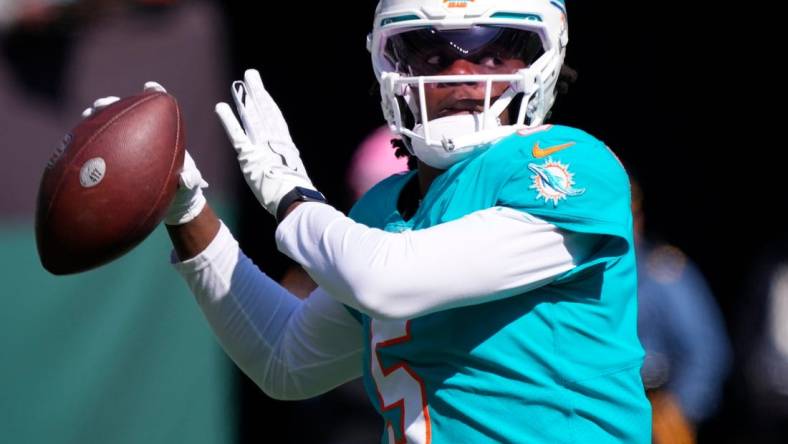 Oct 9, 2022; East Rutherford, New Jersey, USA; Miami Dolphins quarterback Teddy Bridgewater (5) warms up before the game against the New York Jets at MetLife Stadium. Mandatory Credit: Robert Deutsch-USA TODAY Sports