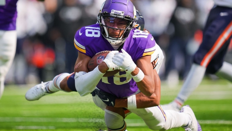 Oct 9, 2022; Minneapolis, Minnesota, USA;  Minnesota Vikings wide receiver Justin Jefferson (18) catches a pass against the Chicago Bears in the first quarter at U.S. Bank Stadium. Mandatory Credit: Brad Rempel-USA TODAY Sports