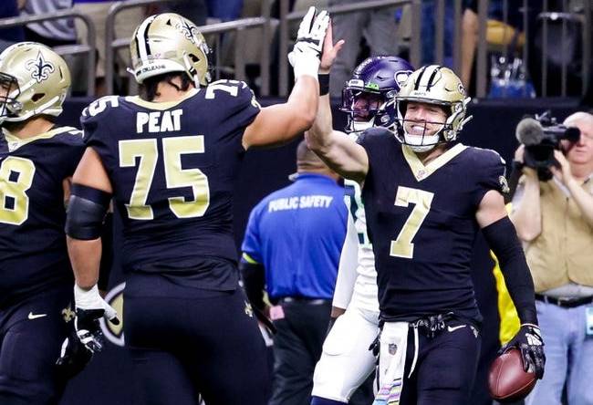 Oct 9, 2022; New Orleans, Louisiana, USA; New Orleans Saints tight end Taysom Hill (7) celebrates a touchdown against the Seattle Seahawks during the first half at Caesars Superdome. Mandatory Credit: Stephen Lew-USA TODAY Sports