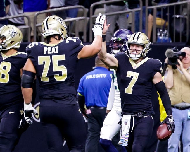 Oct 9, 2022; New Orleans, Louisiana, USA; New Orleans Saints tight end Taysom Hill (7) celebrates a touchdown against the Seattle Seahawks during the first half at Caesars Superdome. Mandatory Credit: Stephen Lew-USA TODAY Sports