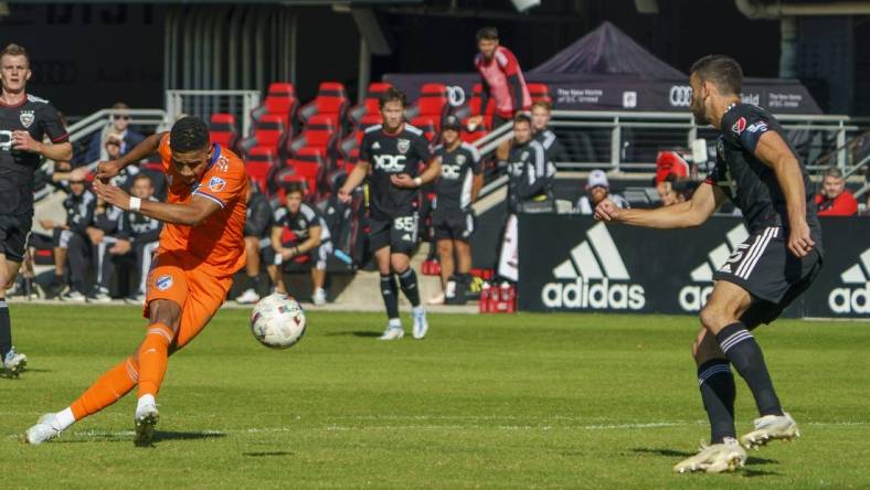 Oct 9, 2022; Washington, District of Columbia, USA; FC Cincinnati forward Brenner (9) shoots and scores a goal against D.C. United during the first half for their fourth goal of the game at Audi Field. Mandatory Credit: Tony Quinn-USA TODAY Sports