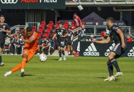 Oct 9, 2022; Washington, District of Columbia, USA; FC Cincinnati forward Brenner (9) shoots and scores a goal against D.C. United during the first half for their fourth goal of the game at Audi Field. Mandatory Credit: Tony Quinn-USA TODAY Sports