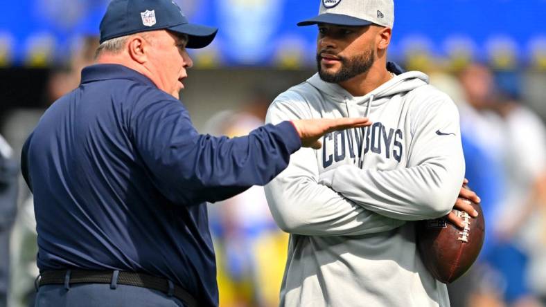 Oct 9, 2022; Inglewood, California, USA; Dallas Cowboys head coach Mike McCarthy talks with quarterback Dak Prescott (4) on the field prior to the game against the Los Angeles Rams at SoFi Stadium. Mandatory Credit: Jayne Kamin-Oncea-USA TODAY Sports