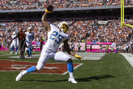 Oct 9, 2022; Cleveland, Ohio, USA; Los Angeles Chargers running back Joshua Kelley (25) celebrates his touchdown run against the Cleveland Browns during the second quarter at FirstEnergy Stadium. Mandatory Credit: Scott Galvin-USA TODAY Sports