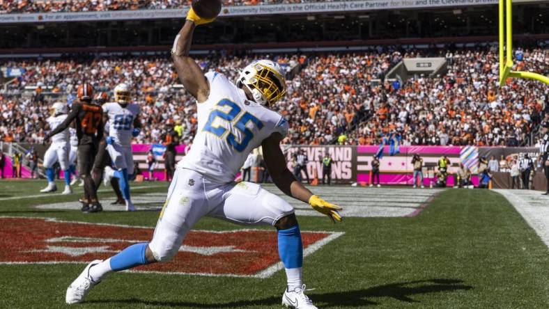 Oct 9, 2022; Cleveland, Ohio, USA; Los Angeles Chargers running back Joshua Kelley (25) celebrates his touchdown run against the Cleveland Browns during the second quarter at FirstEnergy Stadium. Mandatory Credit: Scott Galvin-USA TODAY Sports