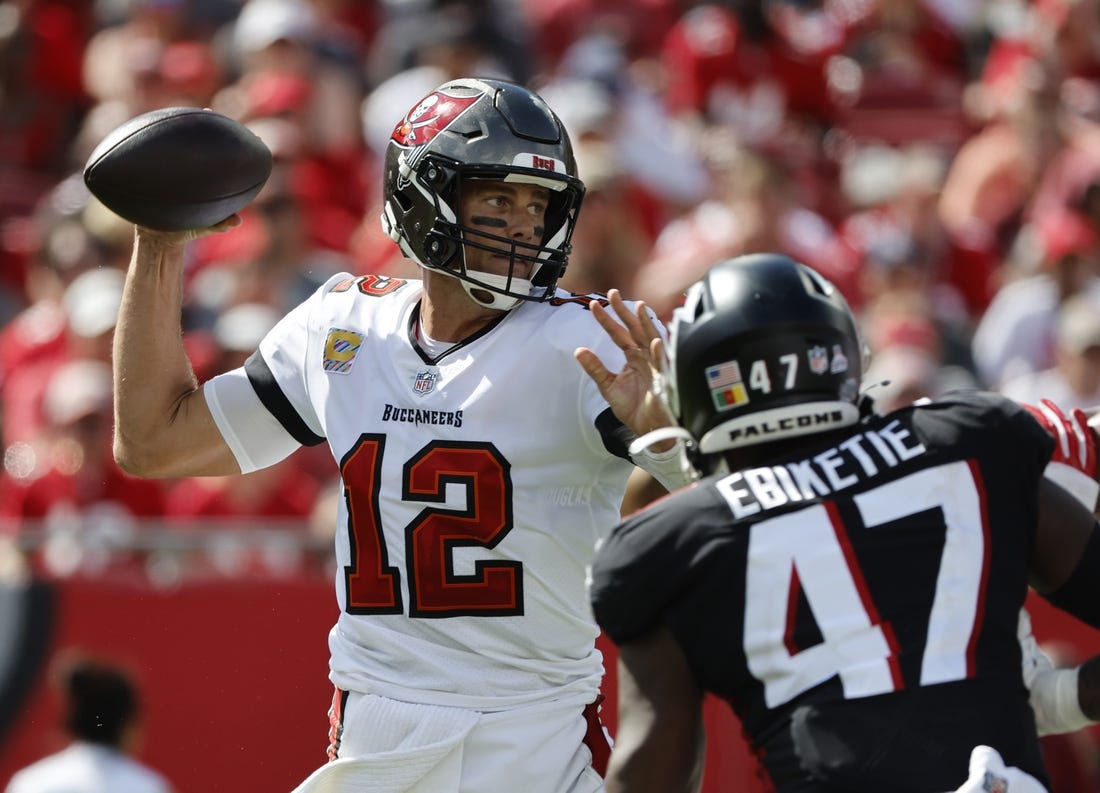 Oct 9, 2022; Tampa, Florida, USA; Tampa Bay Buccaneers quarterback Tom Brady (12) throws the ball against the Atlanta Falcons during the second half at Raymond James Stadium. Mandatory Credit: Kim Klement-USA TODAY Sports