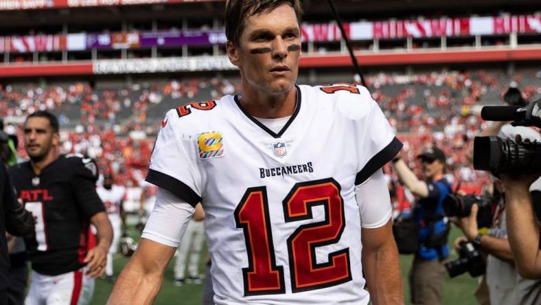 Oct 9, 2022; Tampa, Florida, USA; Tampa Bay Buccaneers quarterback Tom Brady (12) walks off the field after the game against the Atlanta Falcons at Raymond James Stadium. Mandatory Credit: Matt Pendleton-USA TODAY Sports