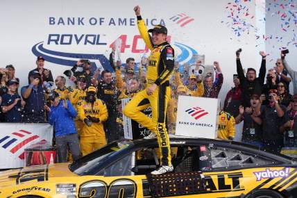 Oct 9, 2022; Concord, North Carolina, USA; NASCAR Cup Series driver Christopher Bell (20) celebrates after winning the Bank of America ROVAL 400 at Charlotte Motor Speedway Road Course. Mandatory Credit: Jasen Vinlove-USA TODAY Sports