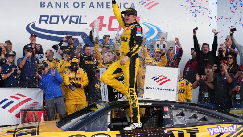 Oct 9, 2022; Concord, North Carolina, USA; NASCAR Cup Series driver Christopher Bell (20) celebrates after winning the Bank of America ROVAL 400 at Charlotte Motor Speedway Road Course. Mandatory Credit: Jasen Vinlove-USA TODAY Sports