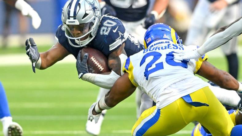 Oct 9, 2022; Inglewood, California, USA; Dallas Cowboys running back Tony Pollard (20) is stopped by Los Angeles Rams safety Terrell Burgess (26) after a short gain in the second half at SoFi Stadium. Mandatory Credit: Jayne Kamin-Oncea-USA TODAY Sports