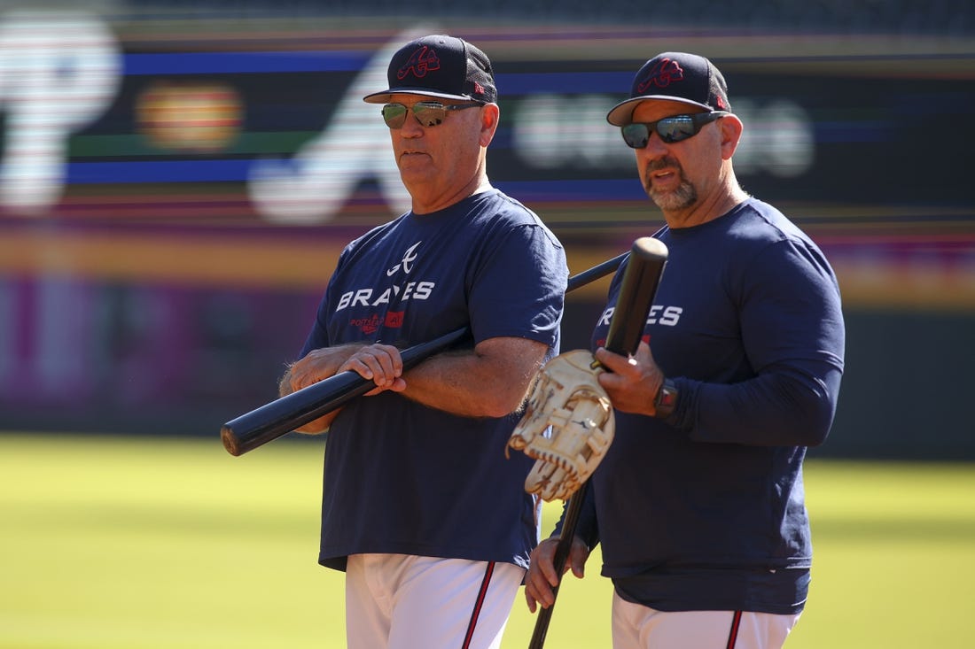 Oct 10, 2022; Atlanta, Georgia, USA; Atlanta Braves manager Brian Snitker (43) and bench coach Walt Weiss (4) during a team workout for the NLDS at Truist Park. Mandatory Credit: Brett Davis-USA TODAY Sports